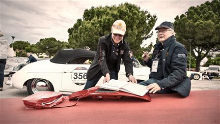 Dr. Porsche signing autographs